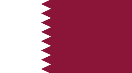 The flag features a white serrated band on the hoist side, with nine white triangles separating it from a maroon field on the fly side