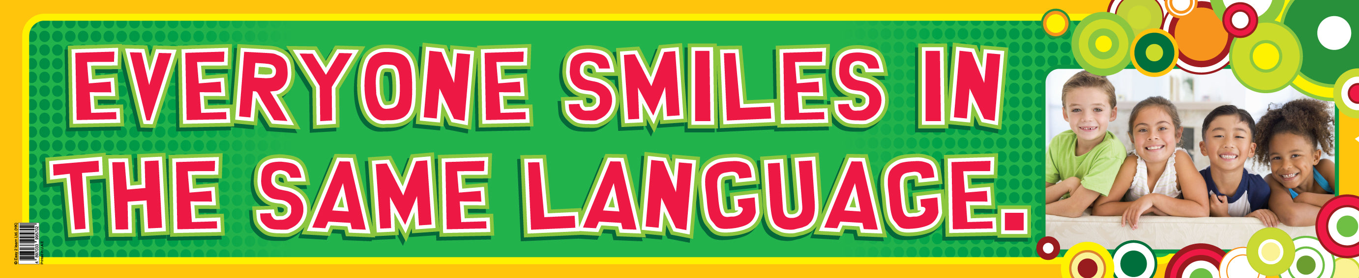 A colorful banner with text 'Everyone smiles in the same language' surrounded by images of smiling people in a classroom setting.